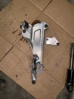 91-02 Honda ST-1100 Left Foot Peg Bracket, 50700-MAJ-G21 Used. Price: $29.00.