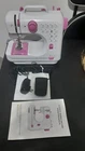 Mini Electric Sewing Machine White/pink Portable Light Foot Pedal Bobbin-wind Used. Price: $19.00.
