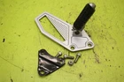 1987-1990 Kawasaki Ninja 750R ZX750 Left Passenger Foot Peg Muffler Stay Bracket Used. Price: $19.95.