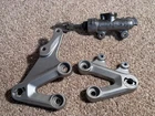 Suzuki K4 2004-05 Left & Right Front Hangers + Brake Cylinder Used. Price: $72.49.