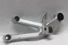 Passenger Footrest Bracket Left 43700-16G30 2006 Suzuki SV1000S Used. Price: $25.00.