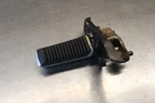 1985 Suzuki GS700ES Left Side Foot Peg Mount Cover Assembly 43502-31300 Used. Price: $35.00.
