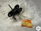 Nos 43520-28000 Suzuki TC125 TS125 Left Front Foot Peg Mount Bracket E2-0649.AEN Used. Price: $5.00.