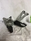 Triumph Tiger 1200 Explorer 2013 Left Footpeg Bracket Assembly T2080774 Linkage Used. Price: $100.00.